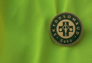 Bild på skyddsombudsmärke.