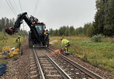 järnväg med huddig och tekniker